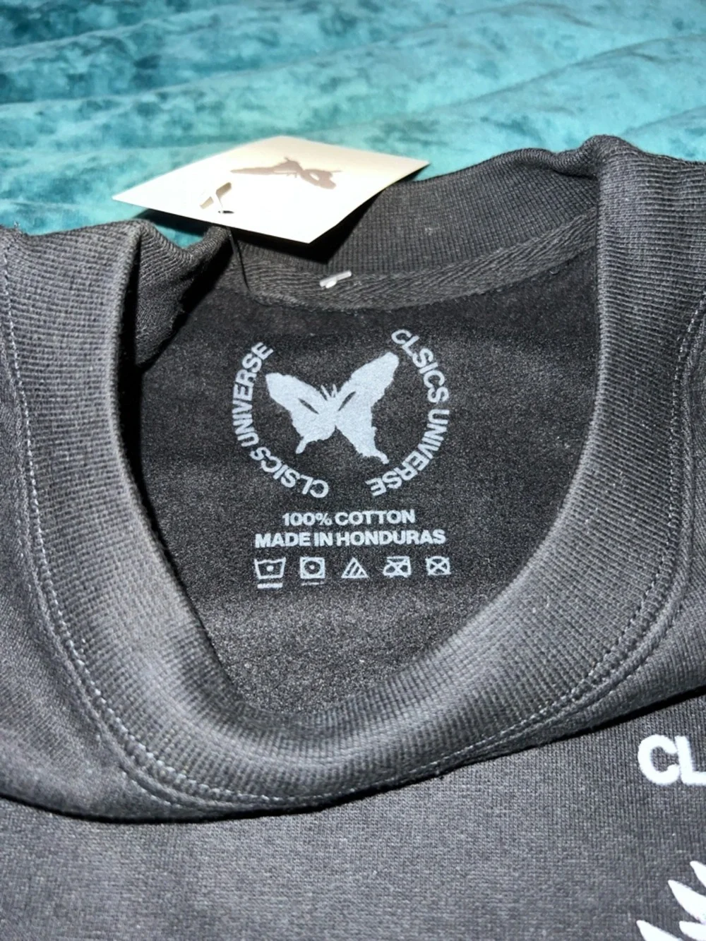 Classic Black Crewneck Sweater with Embroidered Wing Motif CLSICS MAGIC XL